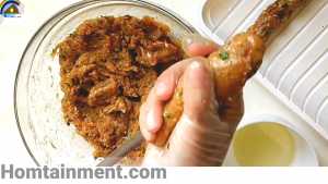 Removing chicken seekh kabab from seekh
