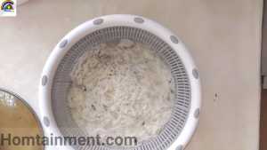 Drain boiled rice for qeema biryani