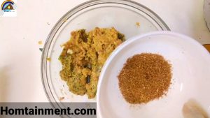 Mixing freshly ground spices in gola kababs